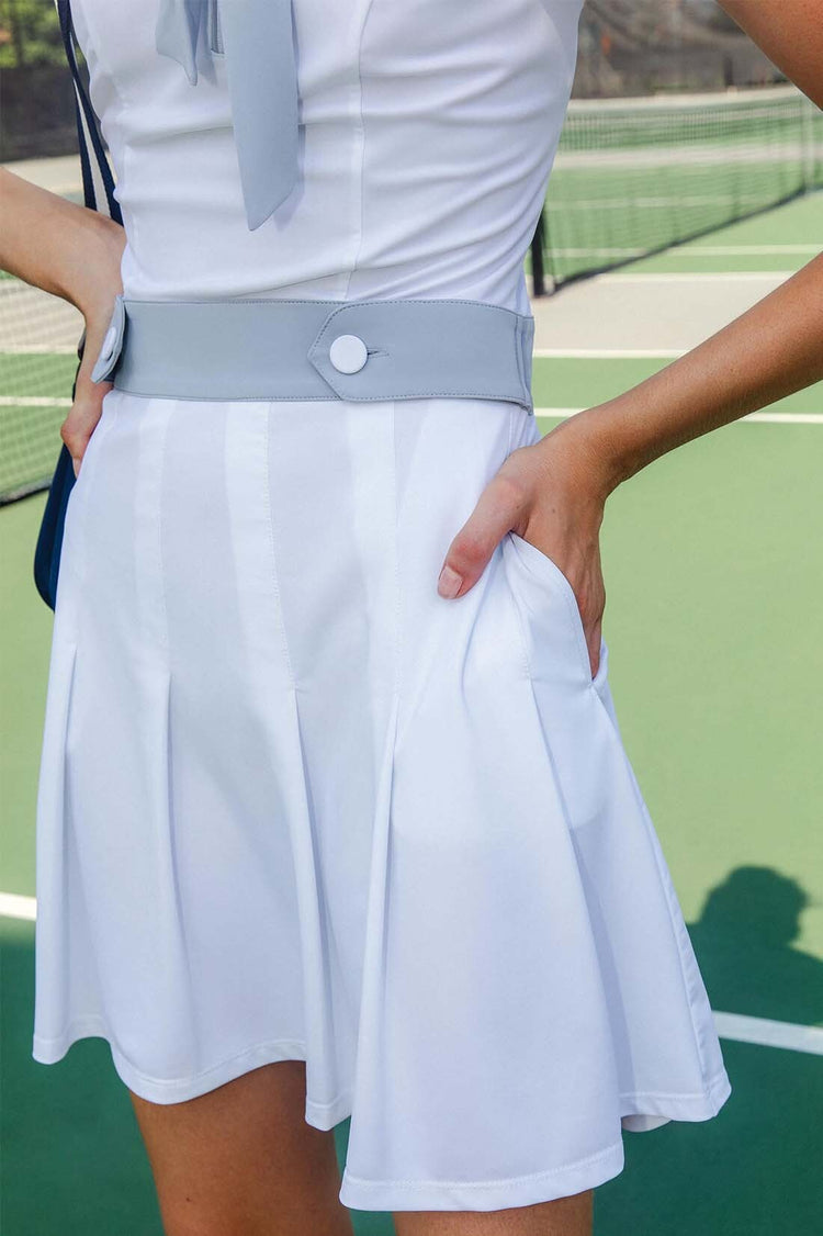 SLEEVELESS PLEATED PERFORMANCE DRESS UPF 50+ IN WHITE