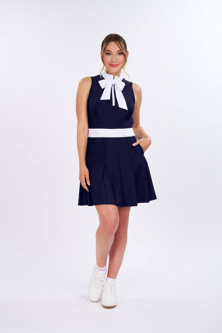 SLEEVELESS PLEATED PERFORMANCE DRESS UPF 50+ IN NAVY